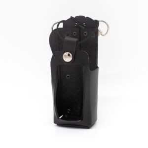 Black leather handgun holster with a securing strap and metal snap, standing upright with a belt loop visible on the back side.