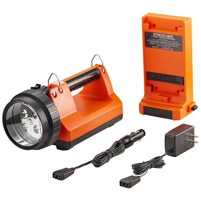 Orange handheld rechargeable flashlight kit with battery pack and power adapters on white background
