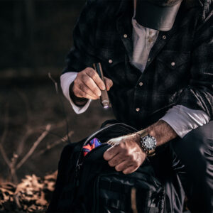 Man using the Wedge to illuminate bag contents