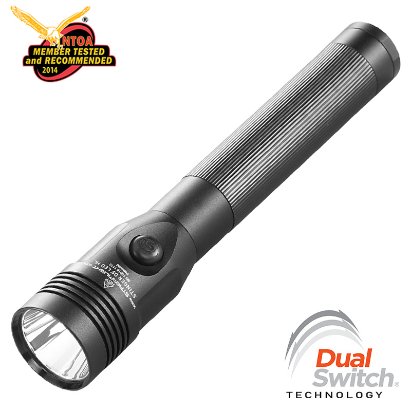 Tactical flashlight with ribbed body, front LED bezel, and a black pushbutton; features Dual Switch Technology and NTOA 2014 Recommended logos.