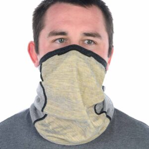 Man wearing a beige neck gaiter pulled up to cover his mouth and nose, with only his eyes visible
